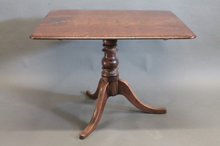A 19th Century rectangular oak breakfast table, raised on pillar  and tripod base 39"