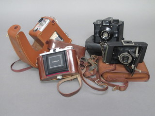 A Neittar camera, a Kodak Brownie 8mm movie camera 2, an  Envoy optimax and a folding Brownie 6-20 camera