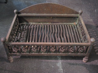A large wrought iron fire grate 28"