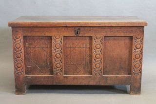 An 18th Century oak coffer of panelled construction with hinged lid 48"