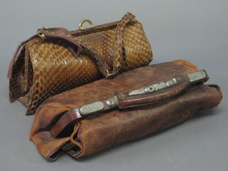 A leather Gladstone bag and a crocodile skin handbag