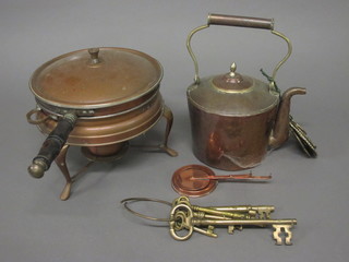 A copper kettle and a small collection of brassware