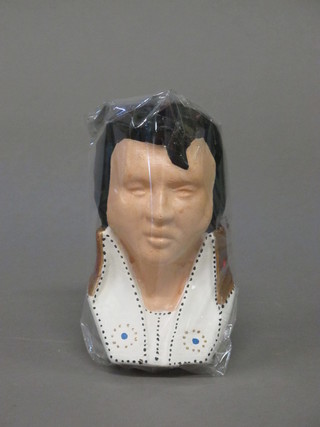 A wax candle in the form of a portrait bust of Elvis Presley 6"
