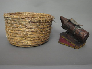 A bee smoker together with a round straw bee skep 15"