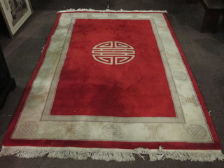 A red ground Chinese carpet 110" x 72"