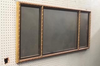 A rectangular triple plate over mantel mirror contained in a decorative gilt frame 18" x 44"