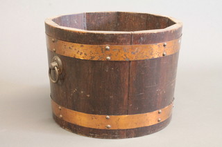 A circular coopered oak jardiniere with ring drop handles 13"