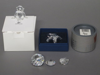 A Swarovski figure of a seated Monkey, 1 1/2", do. Star Fish  2", do. Duck 1", 2 spheres and a rectangular Swarovski plaque  marked Mother and Child 1990-1992, together with 4 stands