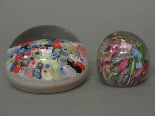 A circular glass paperweight 3" and 1 other 1"