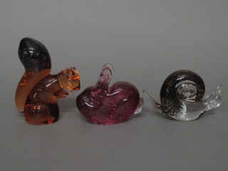 A brown glass paperweight in the form of a squirrel 5", a Wedgwood glass paperweight of a rabbit 3" and 1 other snail 3"