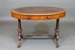 A Victorian mahogany writing table with brown leather inset  writing surface, raised on turned supports with H framed  stretcher 43"