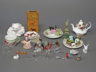 A pottery figure of a curled sleeping cat, various glass figures of animals, 3 wooden match slips decorated dogs, a set of playing  cards decorated dogs etc