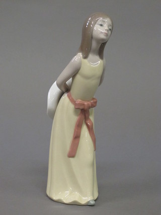 A Lladro figure of a girl wearing a cream dress with bonnet,  base incised S1 9"