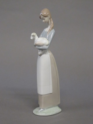 A Lladro figure of a standing lady with lamb 10"