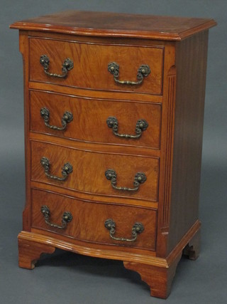 A Georgian style serpentine fronted walnut chest of 4 long drawers, raised on bracket feet 19"