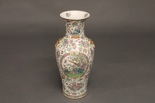 A large 19th Century Canton famille rose porcelain vase of club form 24", heavily f and r,