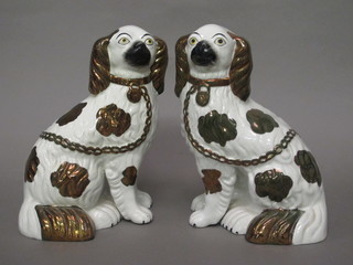 A pair of 19th Century Staffordshire figures of seated Spaniels 9"