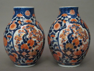 A pair of Japanese Imari porcelain vases with floral decoration 8 1/2", 1f,