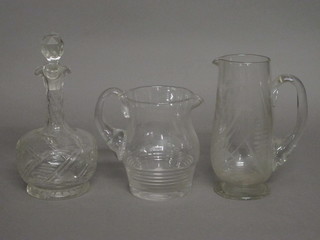 A 19th Century etched glass jug 9", 1 other glass jug 6" and a  club shaped decanter and stopper 9"