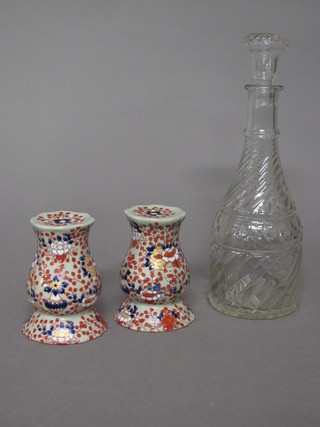 A pair of reproduction Imari patterned pin cushion stands 5" and  a glass decanter and stopper 11"