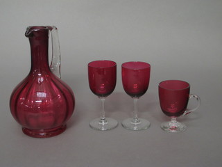 A Victorian cranberry glass ewer 7", no stopper, 2 wine glasses with clear glass stems and a custard glass
