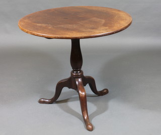 A 19th Century circular mahogany snap top tea table, raised on a turned pillar and tripod support 30"