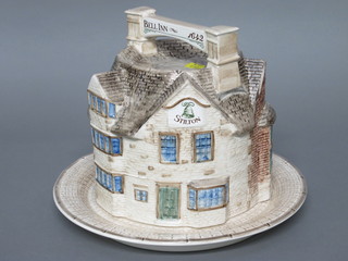A circular London Pottery cheese dish and cover in the form of The Bell Inn, exclusively for Harrods, 12"