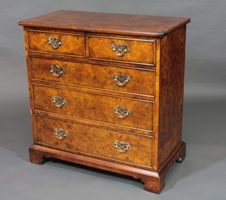 A Queen Anne style figured walnut chest of 2 short and 3 long drawers with brass swan neck drop handles, raised on bracket  feet 30"