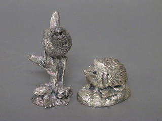 A silvered figure of a seated hedgehog 3" and do. bird 3"