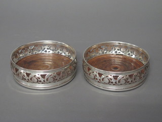 A pair of 19th Century circular pierced silver plated bottle  coasters