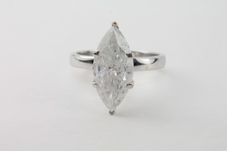 An 18ct white gold marquise shaped solitaire diamond dress/engagement ring, approx 3ct, complete with certificate
