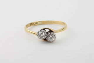 An 18ct yellow gold twist dress ring set 2 diamonds