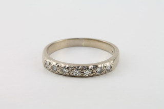An 18ct half eternity ring set diamonds