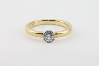 An 18ct yellow gold dress ring set a solitaire diamond, approx  0.5ct