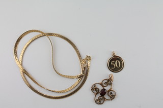A 9ct flat gold chain, a 9ct pendant marked 50 and a gold  pendant