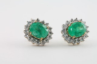 A pair of lady's 18ct gold ear studs set emeralds and diamonds approx. 4.23/1.62cts 2800-3400