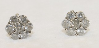 A pair of 9ct white gold diamond set ear studs