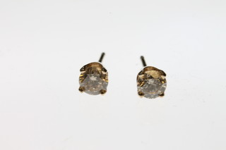 A pair of 14ct yellow gold diamond set ear studs, approx 0.50ct 