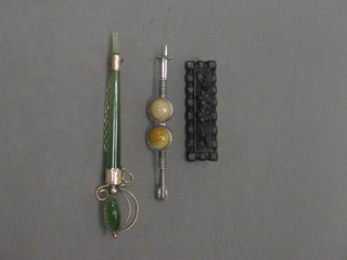 A green hardstone and gilt mounted brooch in the form of a  sword together with 2 other brooches