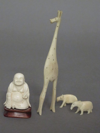 A carved ivory figure of a Buddha 2", an ivory figure of a  giraffe etc