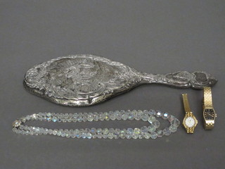 A silver backed hand mirror, a string of crystal beads and 2 ladies wristwatches