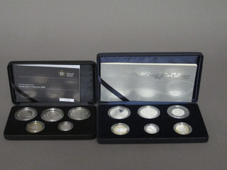 A 2007 set of silver proof coins and a 2008 set of silver proof coins