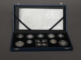 A 2006 silver proof set of coins to commemorate the Queens 80th Birthday