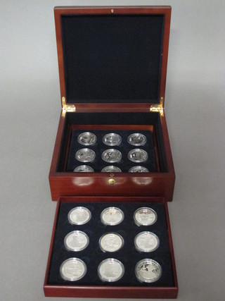 A set of 18 Bailiwick of Jersey silver proof crowns to  commemorate the Bicentenary of the Battle of Trafalgar, contained in a mahogany box