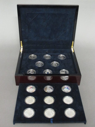 A set of 17 2006 Bailiwick of Jersey silver proof ?5 coins to commemorate the Queens 80th Birthday, contained in a  mahogany case