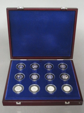 A set of 12 Bailiwick of Jersey 2003 silver proof Jubilee 50  pence pieces, cased