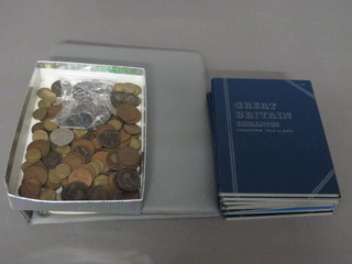 A grey loose leaf album containing various crowns and British coins together with copper coins and 10 paper folders of various  coins