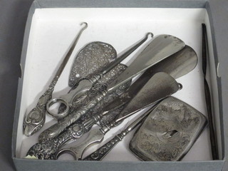 A silver cigarette case - f, 3 silver handled button hooks, 3  silver handled shoe horns, 2 silver filigree hearts etc