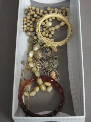 A carved ivory bangle and a collection of costume jewellery