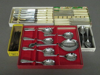 A set of 6 chromium plated fruit spoons, a set of 6 table knives, a set of 6 tea knives and a set of 6 chromium plated teaspoons,  boxed